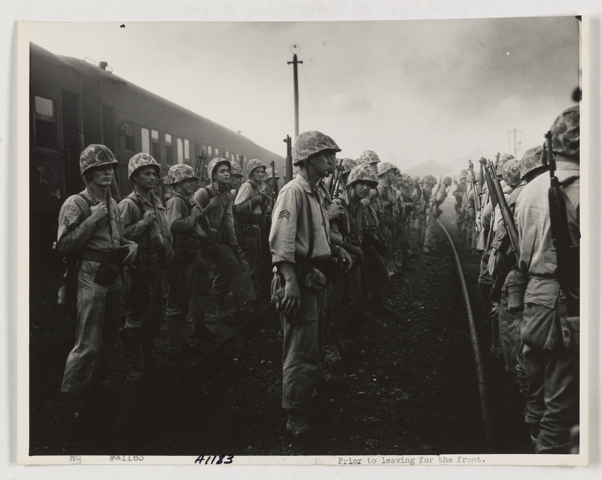 Korean War 3rd platoon of D Co, 2nd Bn, 5th marines muster at train station