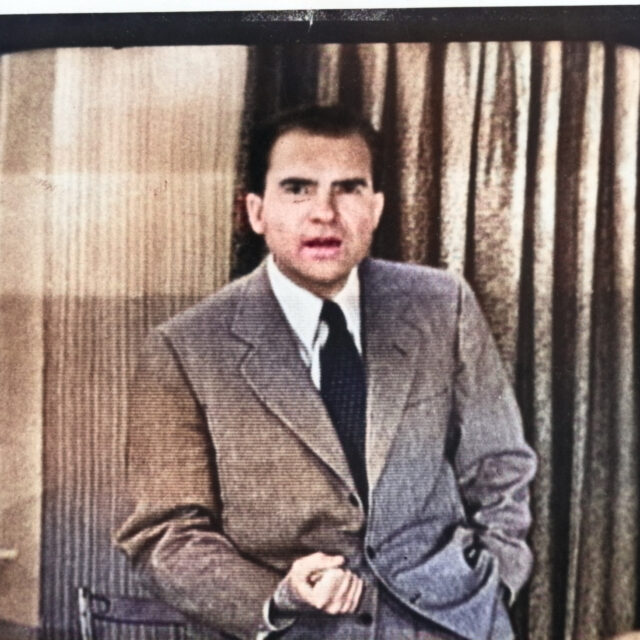 Richard Nixon on a vintage TV screen with static, delivering the Checkers speech.