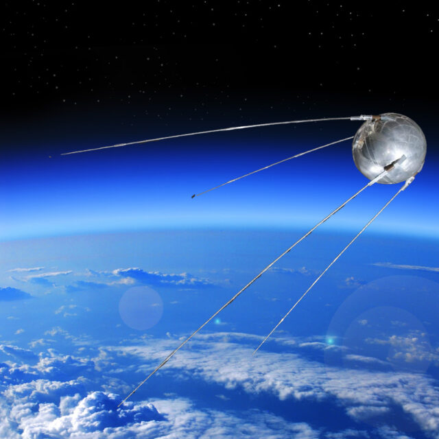 Composite image of Sputnik replica orbiting Earth.